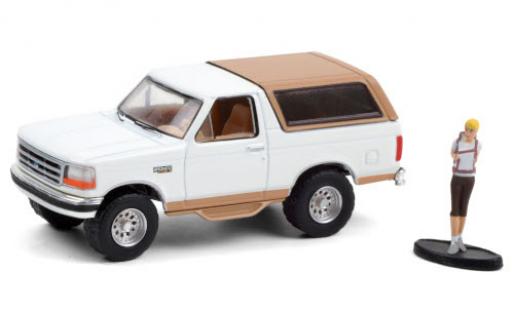 Ford Bronco 1/64 Greenlight Eddie Bauer white/matt-beige 1996 avec figurine diecast model cars